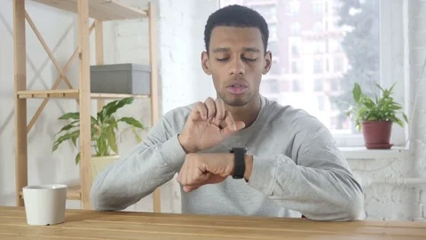 Afro-American Man Using Smartwatch for Browsing, Email and Messages Video stock 83498960