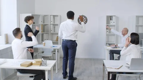 Afro-American Office Worker Throwing Darts Stock Footage 108664205