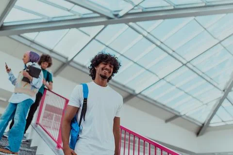 An Afro-American student with a blue backpack Stock Photos