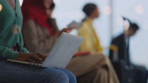 Afro-american young woman in queue using laptop computer freelancing working Stock Footage 147616891