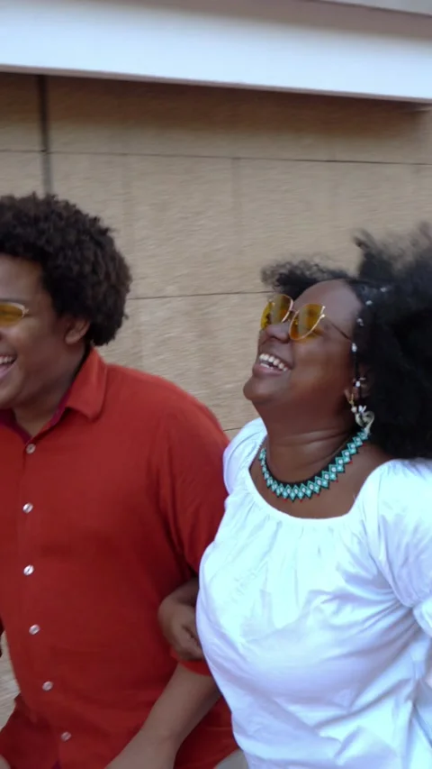 Afro couple strolling in the street Stock Footage 228117285