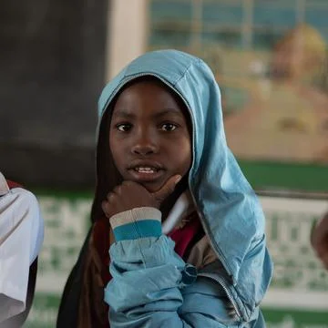 Afro-descendent students are attending school at a rural village in Malawi. Stock Photos