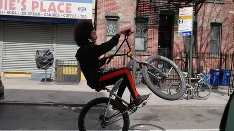 Afro Kid Doing Wheelie On BMX Bike Stock Video Pond5