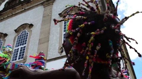 Afro local man making a wish with the colorful religious brazilian ribbons Stock Footage