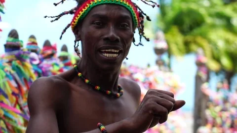 Afro man dancing around the a colorful religious brazilian ribbons in Salvador Stock Footage