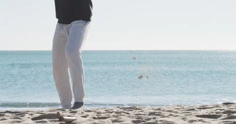 Afro man with dreadlocks training martial arts on a beach. Stock Footage 146951707
