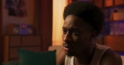 An Afro man has broken up with girlfriend and is spending the weekend alone at Vidéo 200813311