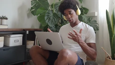 Afro man making a video call at home with a laptop Stock Footage 159542063