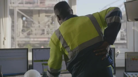 Afro technician having backache Stock Footage 114329374