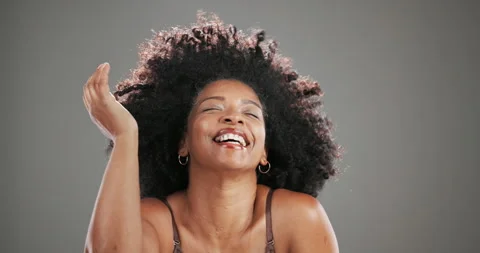 Afro, wind and textures with face of black woman in studio for curly hair Stock Footage 310599825