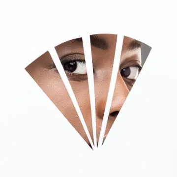 Afro woman with natural makeup looking through geometry hole in paper Stock Photos