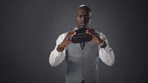 Afroamerican man trying the VR headset Stock Footage