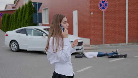 After accident car crashed with scooter driver injured on ground. Realizing Stock Footage 272964541
