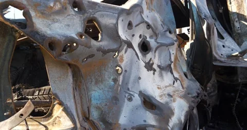 After bombing, mangled metal of car, burned by russian missile in Kyiv, Ukraine Video stock 197172919