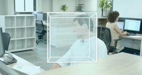 After brief delay tech worker clearing docs wireframe cube forming with code Stock Footage 314868984