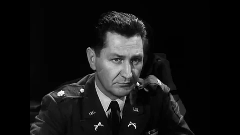 After a briefing, a Commanding Officer authorizes a Chief Warrant Officer and an Stock Footage 126049062