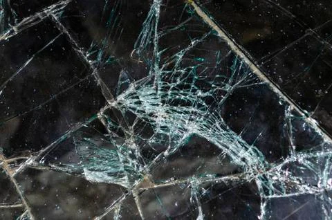 After the car crash, windshield fall on the road surface. Stock Photos
