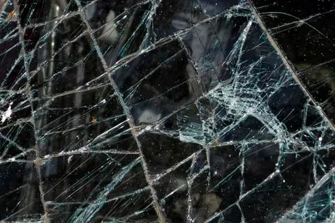 After the car crash, windshield fall on the road surface. Stock Photos