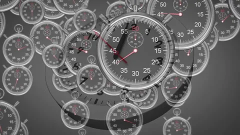 After clock face appearing small stopwatches emerging from edges and rotating Stock Footage 311916170