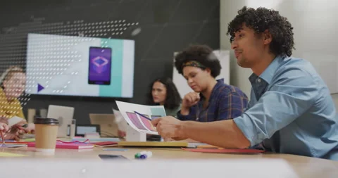 After code overlay fading, design team reviewing swatches selecting layout with Stock Footage 312693924