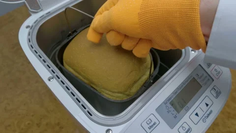 After completing the bread baking program, we take out the baked bread pan Stock Footage 152004664