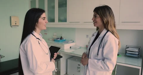 After conversation two pretty Latina women colleagues physicians shaking hands Video stock 270365745