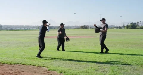 After count call, male teammates underhand-throwing baseballs stepping inward Stock Footage 339650846
