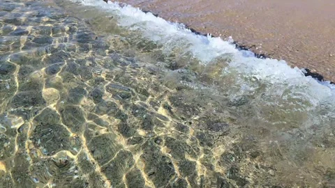 After dawn, multidimensional solar lace dances in the awakening crystal sea. Stock Footage 303979951