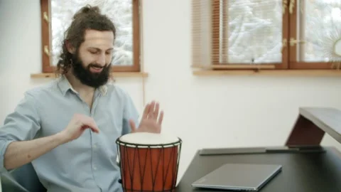 After finishing the office work or video call, the man takes the tool and starts Stock Footage 146979107