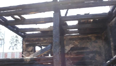 After a fire burned down structure of a wooden apartment house Stock Footage 94224901