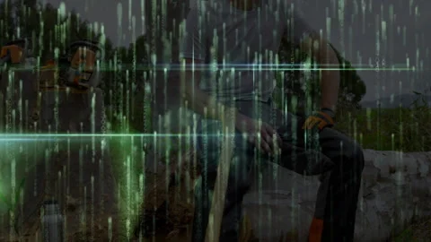 After glitch lumber worker sitting on log with axe scanning forest while green Vidéo 314408229