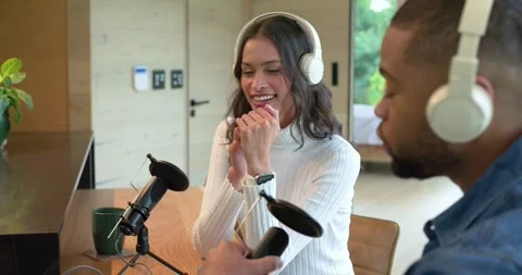 After headset tuning, Diverse co-hosts testing microphone and headphone levels Stock Footage 335454011