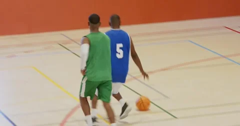 After layup bouncing off rim african american man grabbing ball dribbling down Stock Footage 340770701