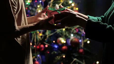 After a long separation, she gives wrapped in red paper tied with a green ribbon Stock-Footage 163450000