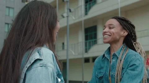 After long separation two people frends mixed race go to meet each other hugging Stock Footage 158281957
