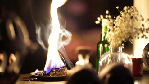 After the occult session extinguish the flame with an iron bell 스톡 동영상 130241043