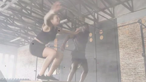 After prep workout partners performing plyo jumps on boxes finishing set, Stock Footage 333078312