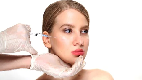 After the professional injection botox into the cheekbones, the girl smiles Stock Footage 85569601
