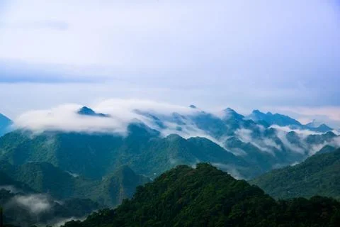 After the rain, the cloudscape on the top of the mountain is ever-changing. Stock Photos