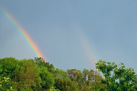 After rain double rainbow Stock Photos