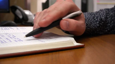 After reading the written, the man signed Stock Footage 111578603