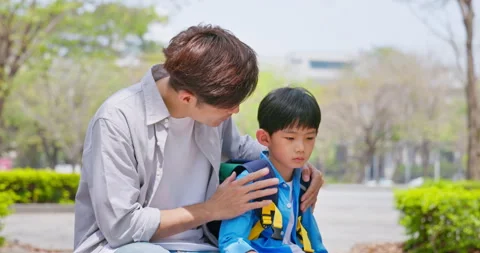 After school father comforts son Stock Footage 243433105