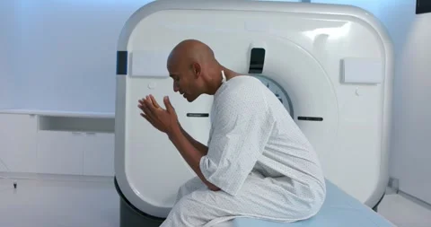 After spotting small item, patient is inspecting then covering face while Stock Footage 344254064