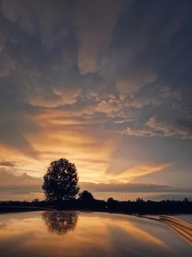 After the storm view with sunset rays piercing the wonderful Mammatus clouds Stock Photos