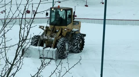 After a strong cyclone - the tractor very much helps to clear snow Stock Footage 11710526