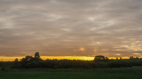 After sunrise 4k timelapse with cloudy sky over meadow. Stock Footage 58669152