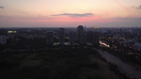 After sunset aerial view of Bucharest city skyline from Vacaresti Delta Stock Footage 246590721