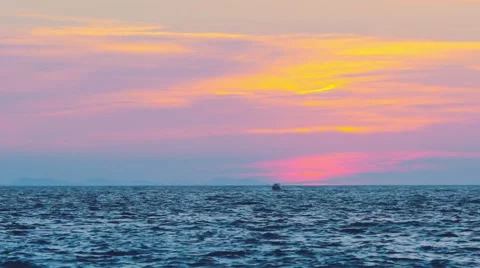 After the sunset on the beach with boat on the waves Stock Footage 67094215