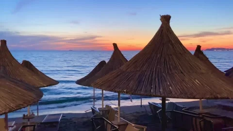 After sunset on the evening beach. The orange color  of the sky. Stock Footage 247372334