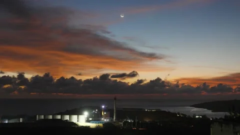 After sunset in the evening, the colorful clouds on the sea covered the sky 動画素材 142247858